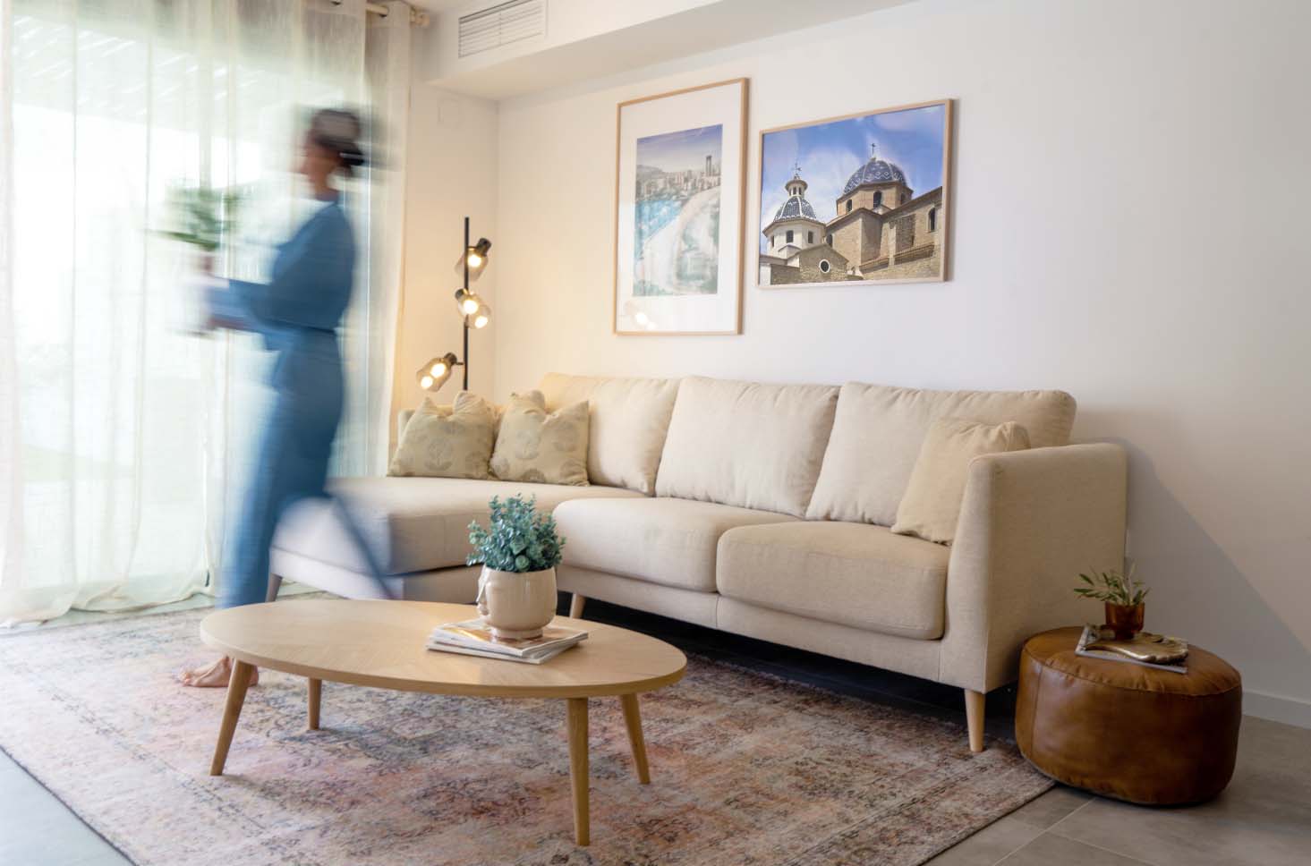 Stylist walking through living room Seascape Resort Finestrat